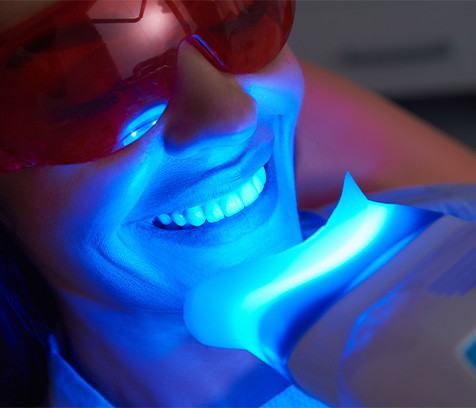 A patient receiving teeth whitening treatment