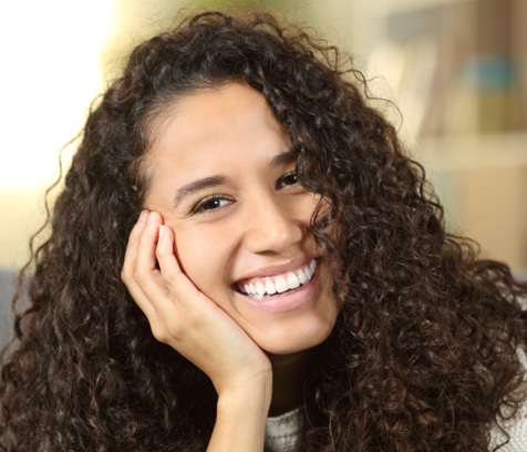 a close-up of a dental patient smiling  