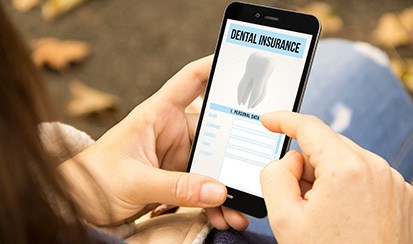 a patient reviewing a digital dental insurance form