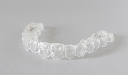 a close-up of an Invisalign aligner