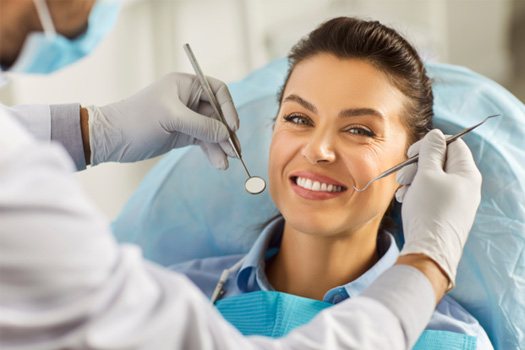 Woman smiling at dental checkup