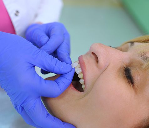a patient smiling during a dental appointment 