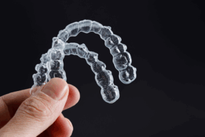 a close-up of two Invisalign aligners