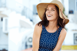 a woman showing off her smile during the summer