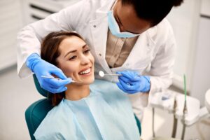 a patient smiling while visiting the dentist